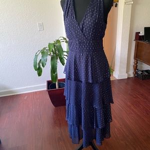 Pretty navy Sun dress by Taylor. Ruffle skirt , tie back fully lined